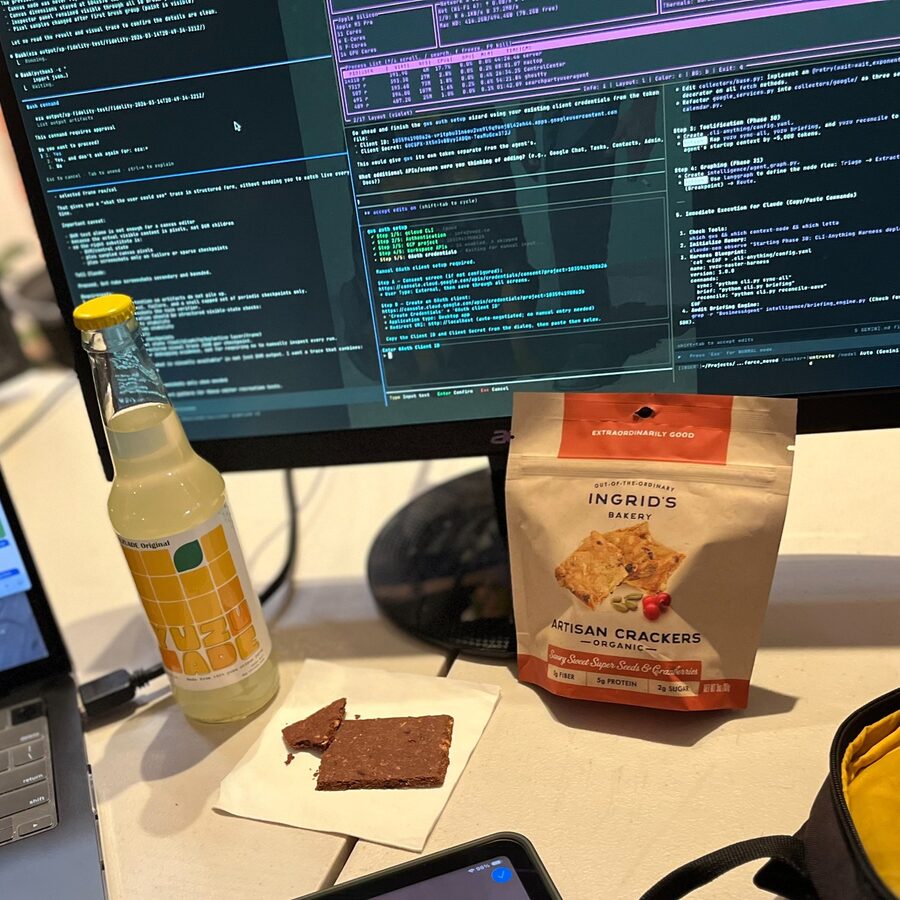 YUUZ bottle and Ingrid’s Bakery snack at a desk
